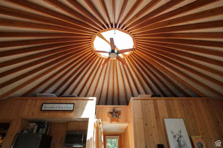Detailed view of fridge and wood walls