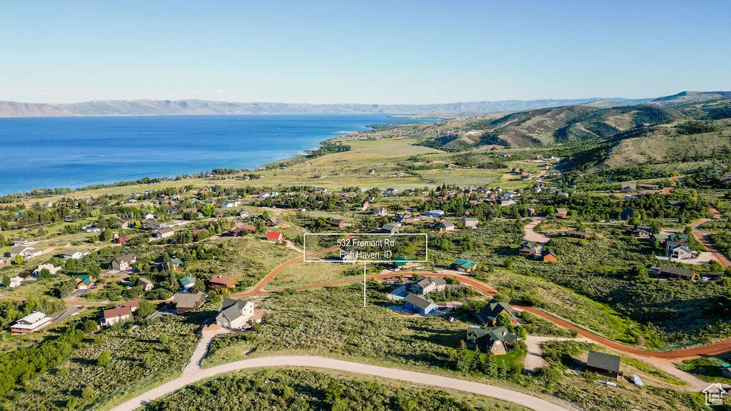 View of property location featuring a water and mountain view and property parcel outlined