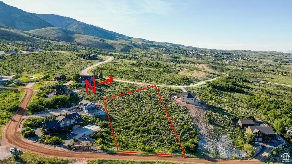 View of property location with property parcel outlined and a mountain backdrop