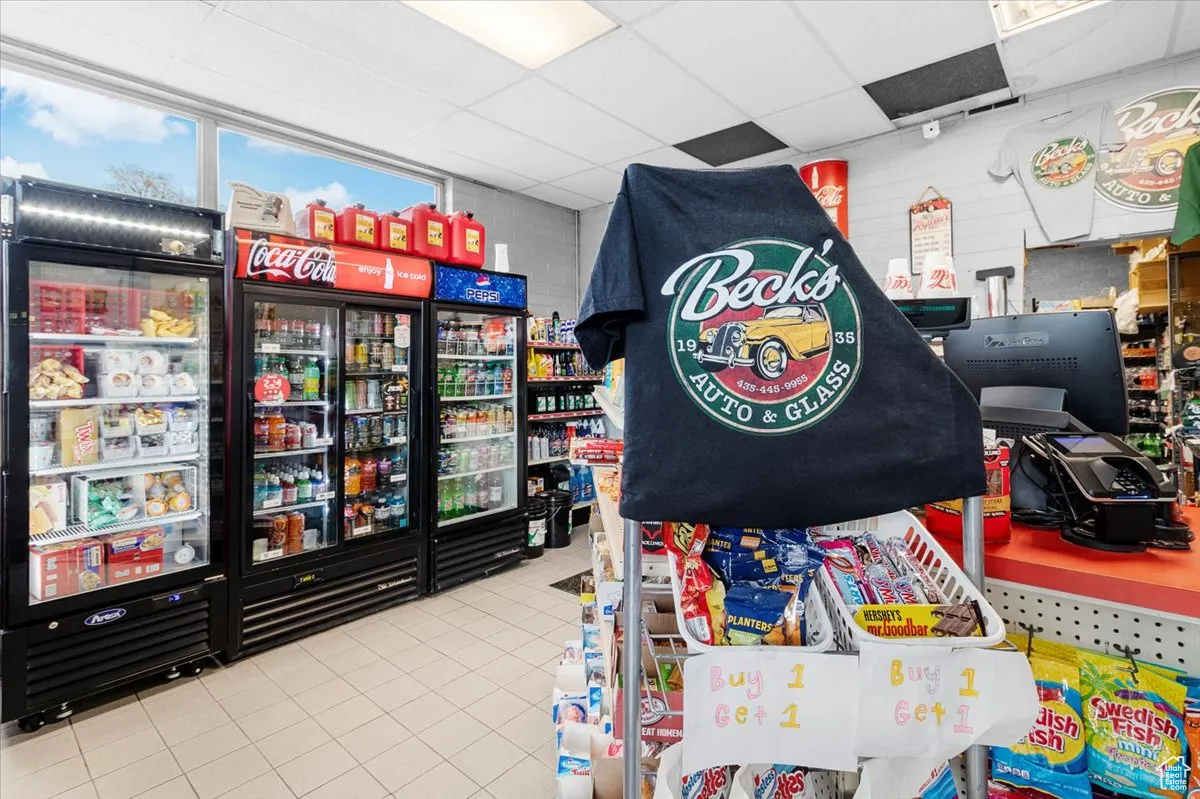 Miscellaneous room featuring tile patterned flooring and a drop ceiling