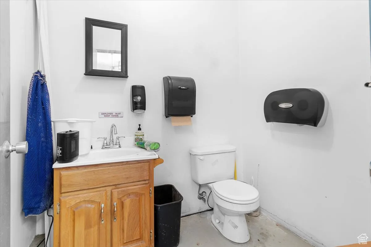 Half bath featuring vanity and toilet