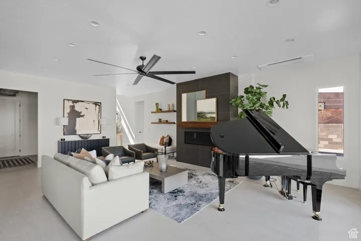 Living room featuring ceiling fan and recessed lighting