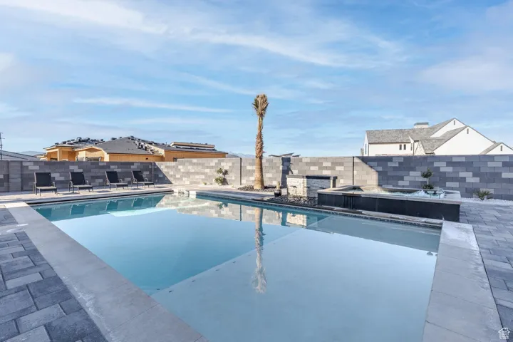 View of pool featuring a patio and a fenced backyard