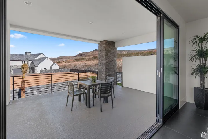 Patio / terrace featuring a mountain view and outdoor dining area