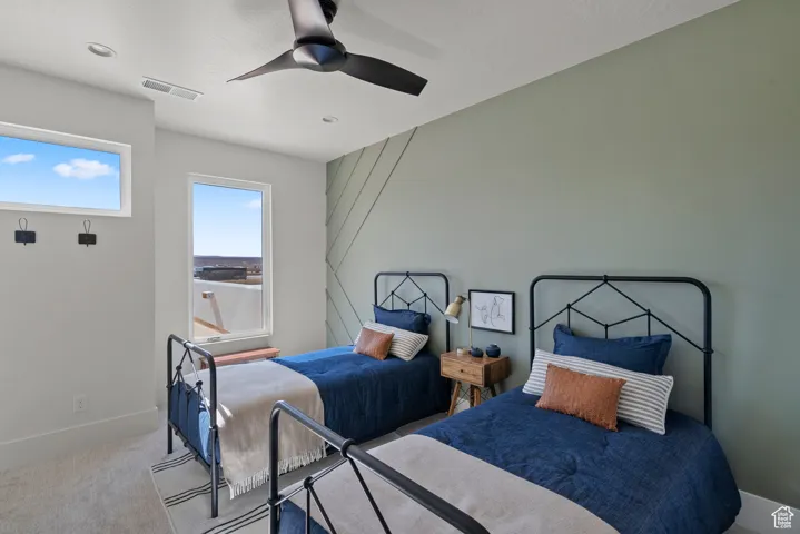 Bedroom featuring carpet flooring and ceiling fan