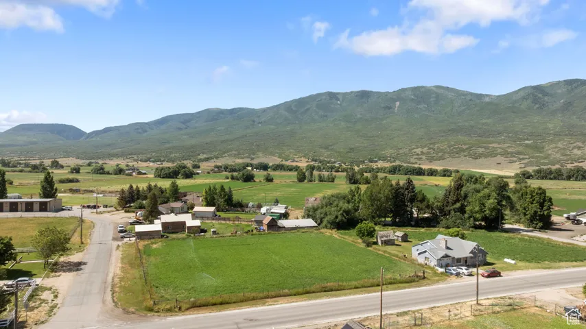 View of mountain backdrop with rural landscape