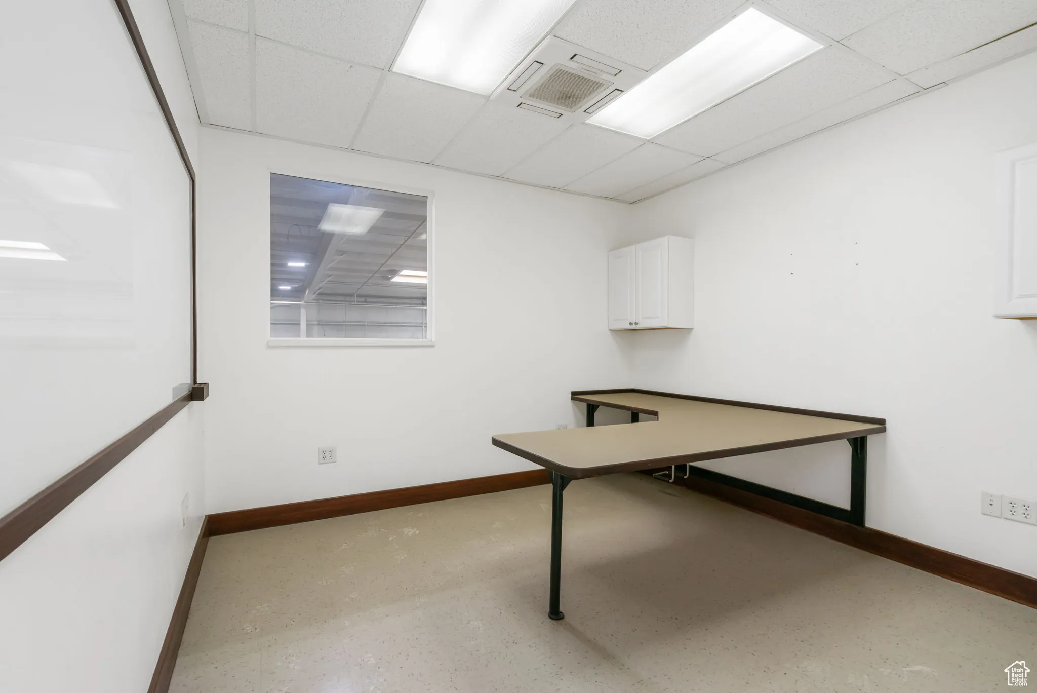 Unfurnished office with a drop ceiling