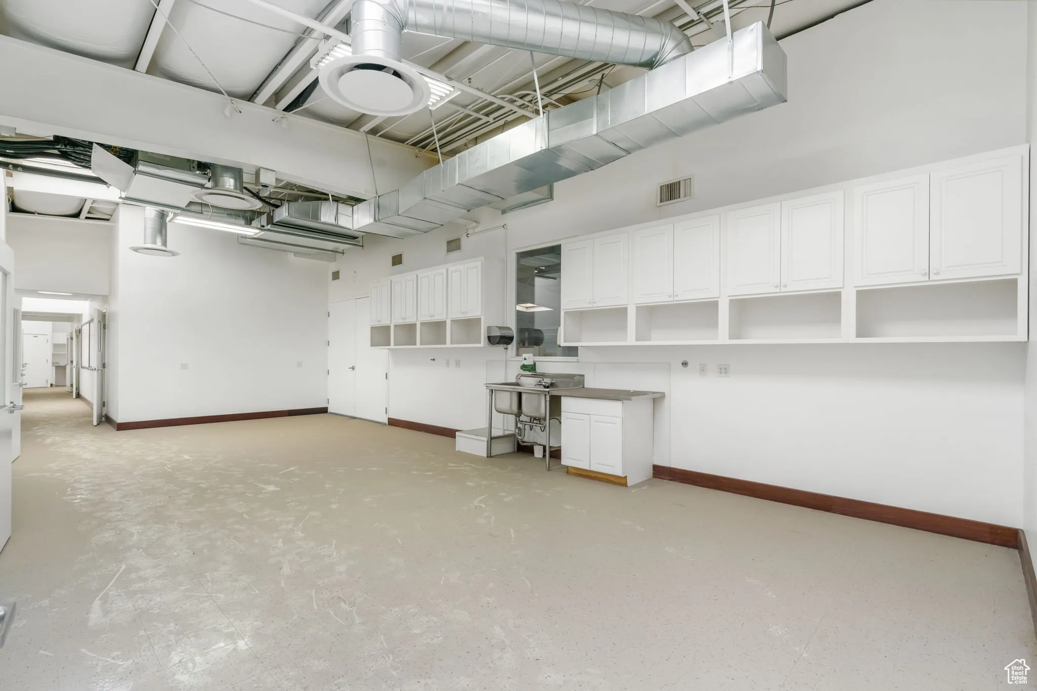 Garage featuring baseboards