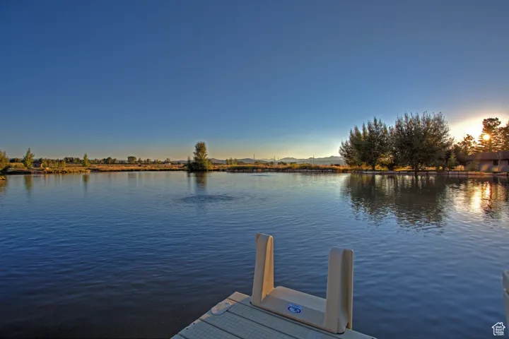 Dock area featuring a water view