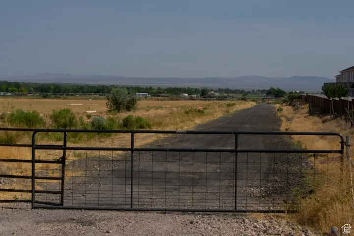 View of yard featuring a view of countryside and a mountain view