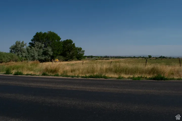 View of asphalt road with a view of countryside