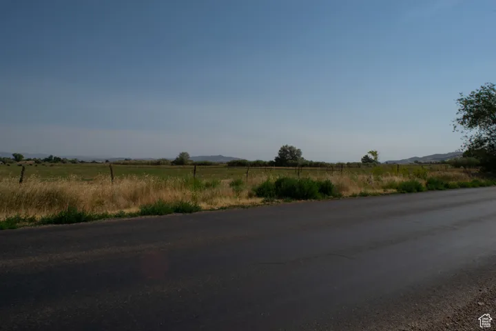 View of asphalt road with a rural view and a mountain view