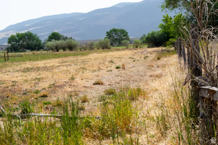 View of mountain backdrop featuring rural landscape