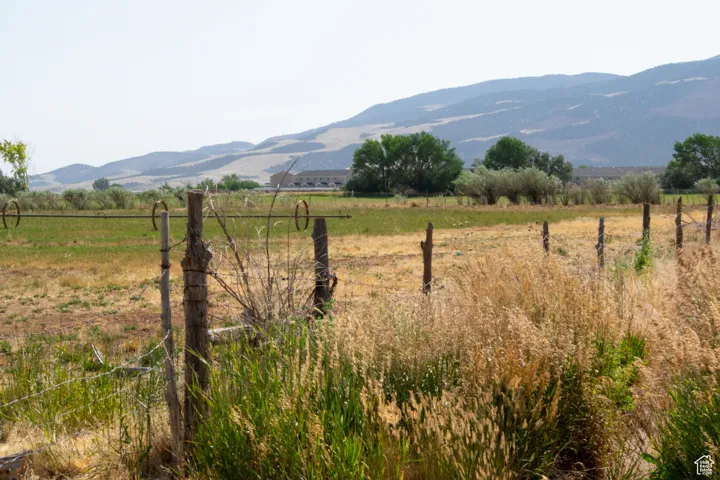 View of mountain background featuring rural landscape