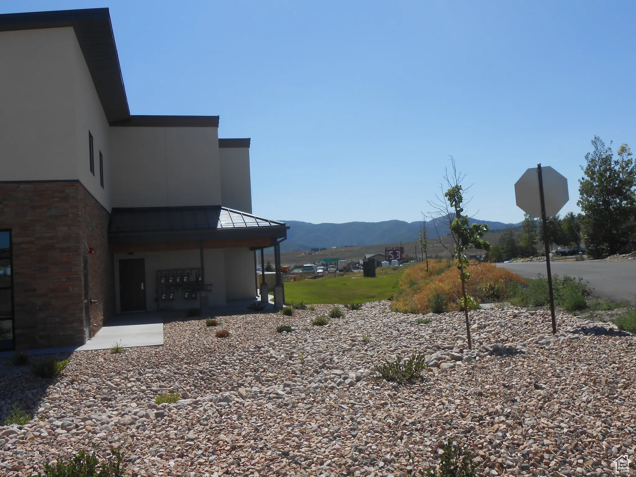 View of yard featuring a mountain view and mail area