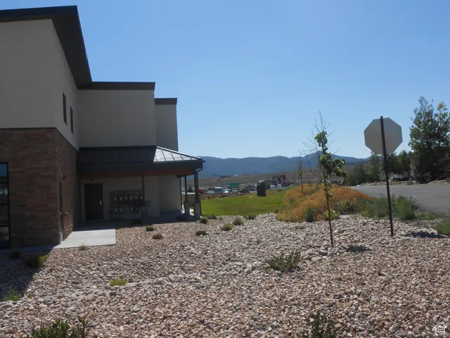 View of yard featuring a mountain view and mail area