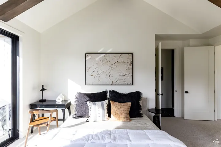 Carpeted bedroom with vaulted ceiling