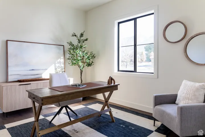 Office space featuring wood finished floors and baseboards
