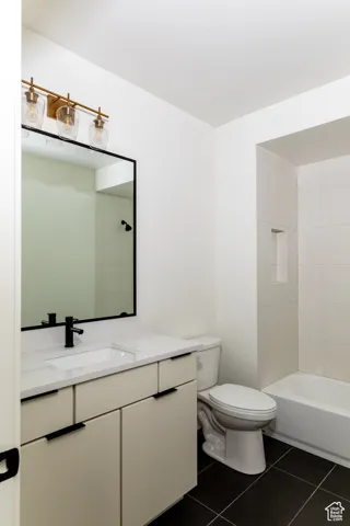 Bathroom featuring vanity and tile patterned flooring