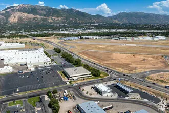 Aerial overview of property's location with a mountainous background