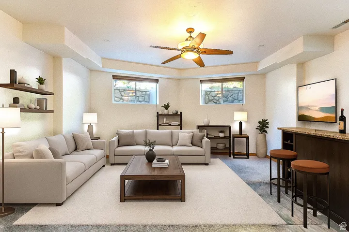 Living area featuring ceiling fan