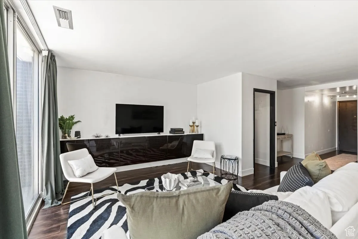 Living area featuring wood finished floors and baseboards
