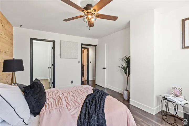 Bedroom featuring dark wood-style flooring and a ceiling fan