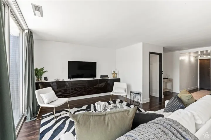 Living area featuring wood finished floors and baseboards
