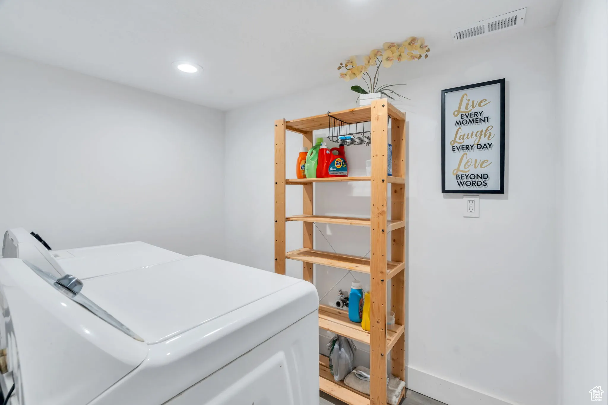 Washroom featuring independent washer and dryer and recessed lighting
