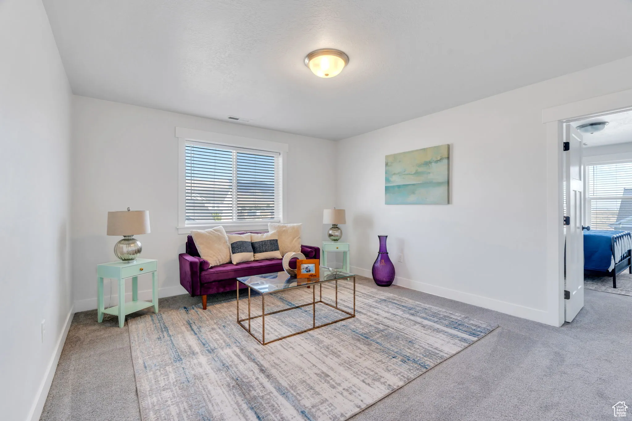 Living area featuring carpet flooring