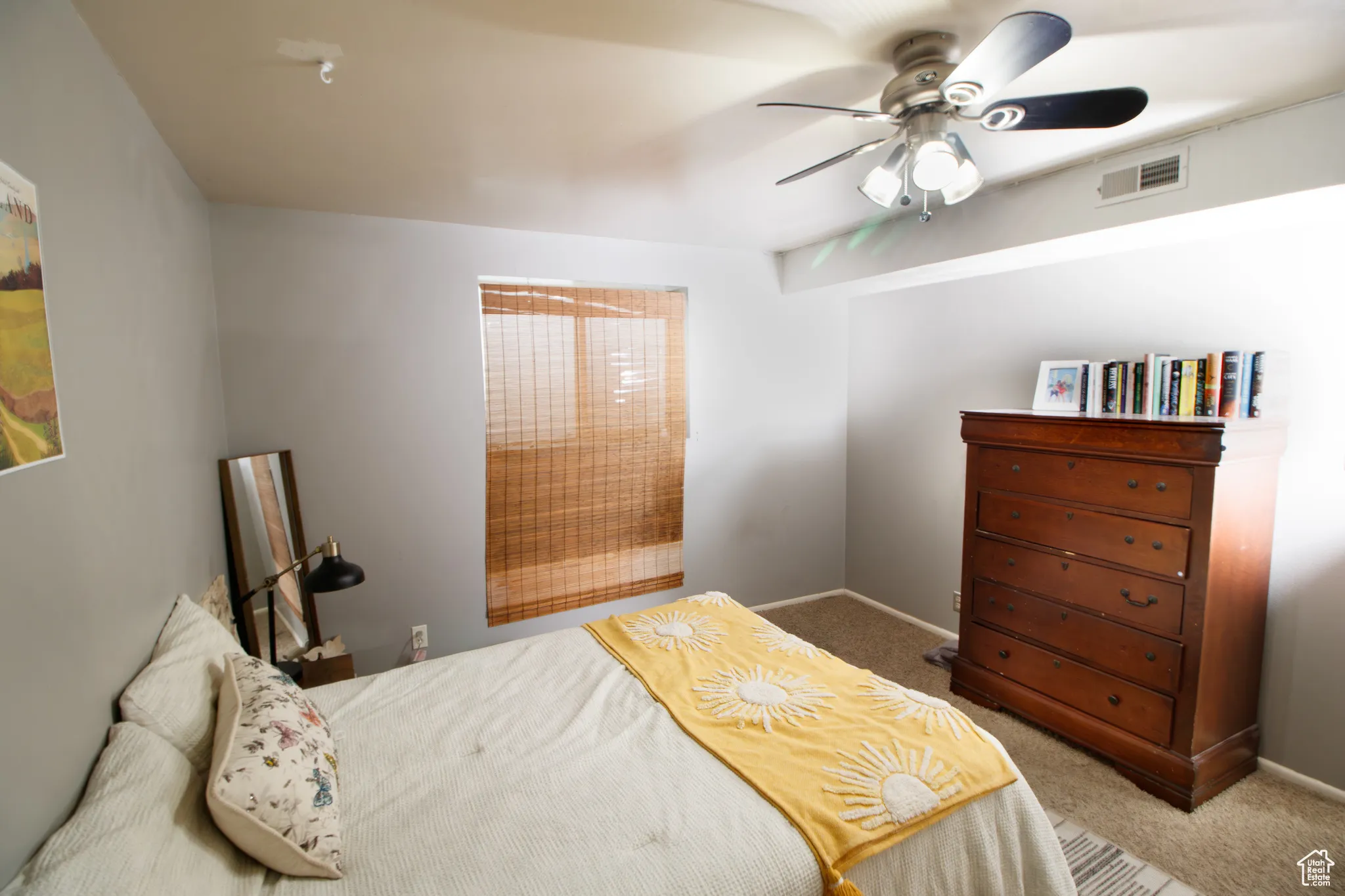 Bedroom with carpet flooring and ceiling fan