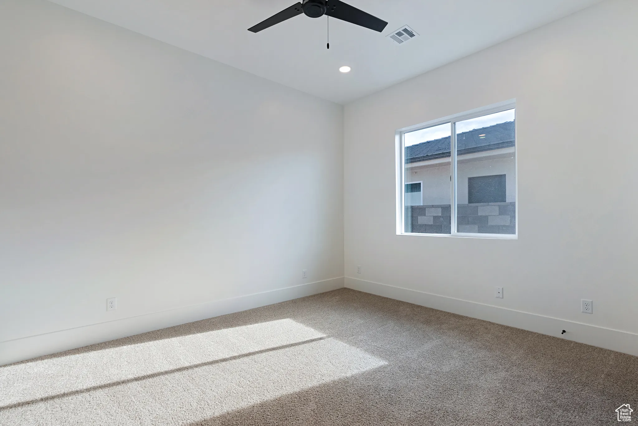 Unfurnished room featuring ceiling fan, carpet floors, and recessed lighting