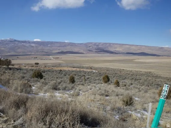 View of mountain background featuring rural landscape