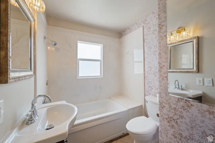 Full bathroom with a bath and toilet