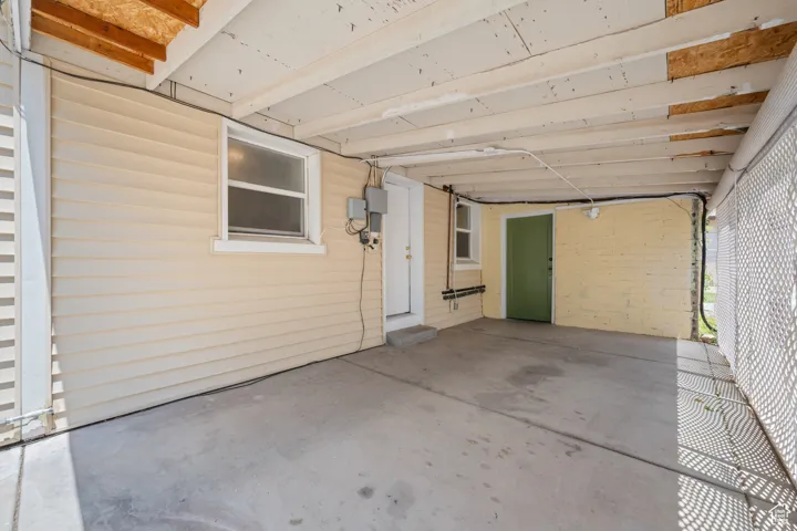 View of patio featuring a carport