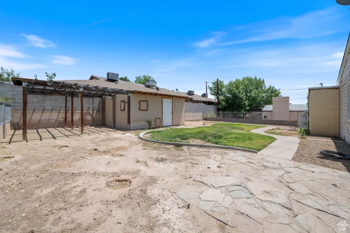 View of fenced backyard