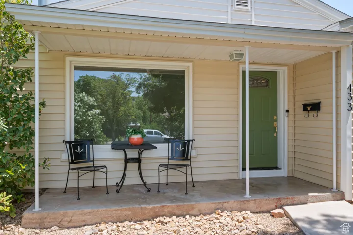 Entrance to property featuring a porch