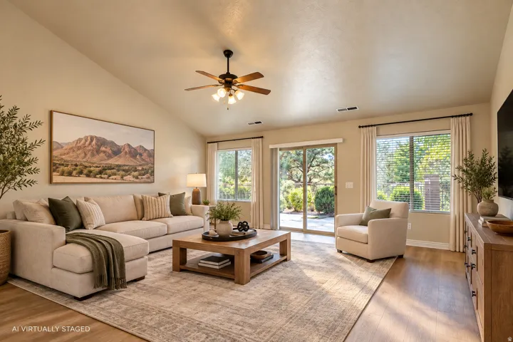 Vaulted ceiling with an attached ceiling fan, recessed lighting, wood-finish flooring, and sliding glass doors to the exterior