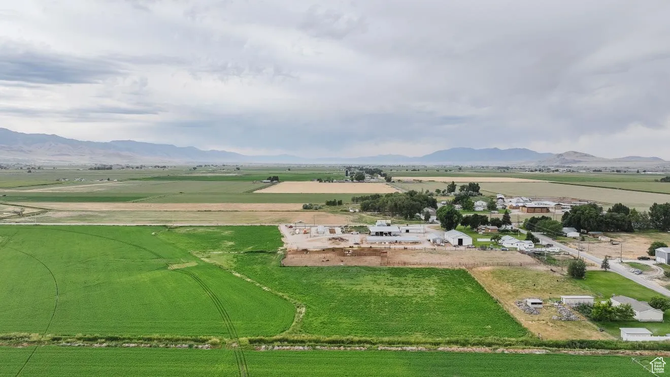 View of mountain backdrop with rural landscape