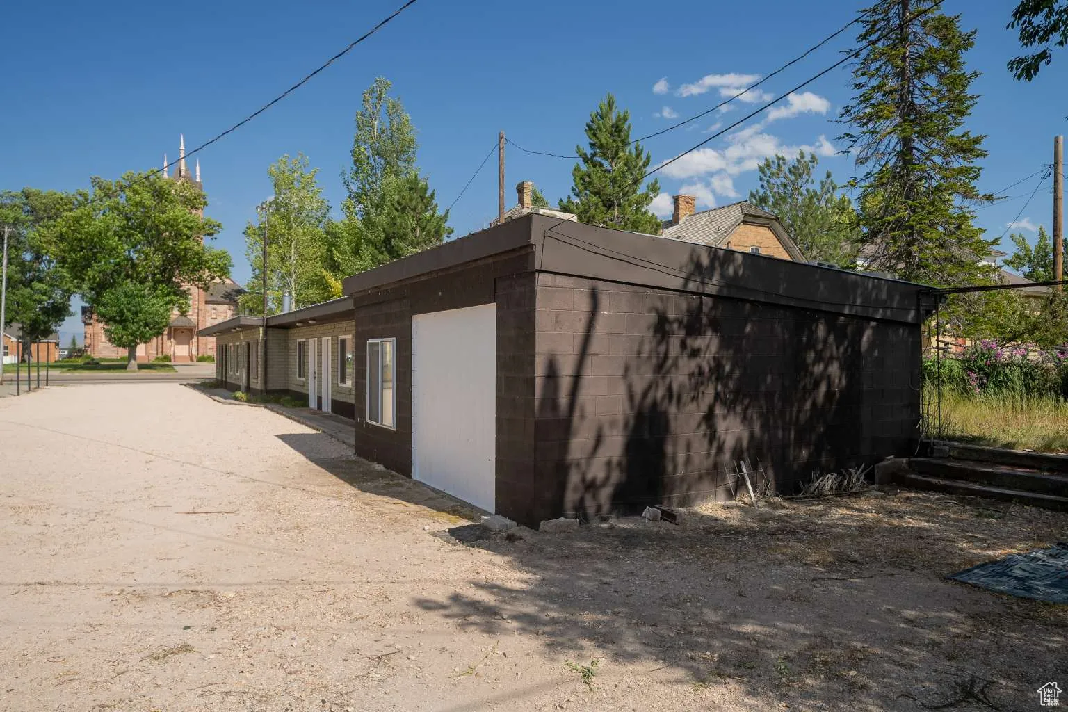 View of side of home with concrete block siding
