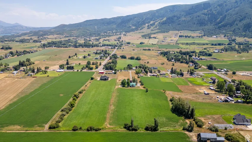 Overview of rural landscape with a mountain backdrop