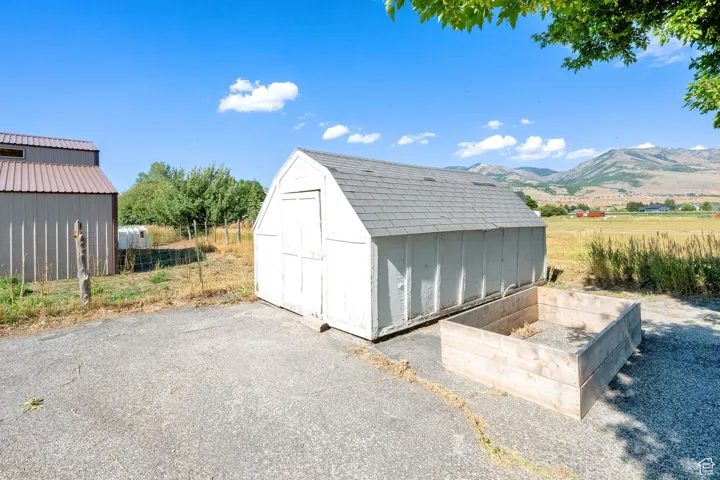 View of shed with a mountain view