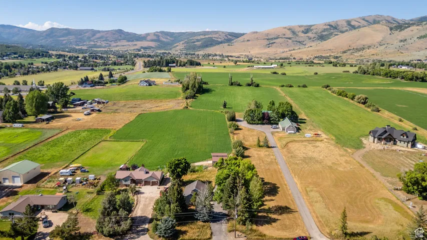 Overview of rural landscape featuring a mountainous background