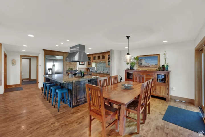 Dining room featuring recessed lighting and light wood-style floors