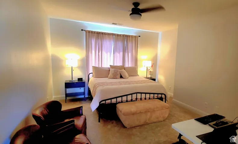 Bedroom featuring carpet and a ceiling fan