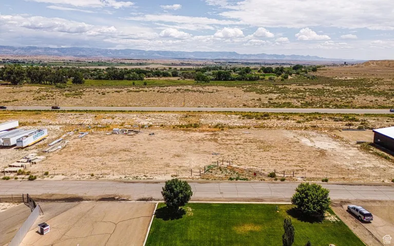 Overview of rural landscape featuring a mountainous background