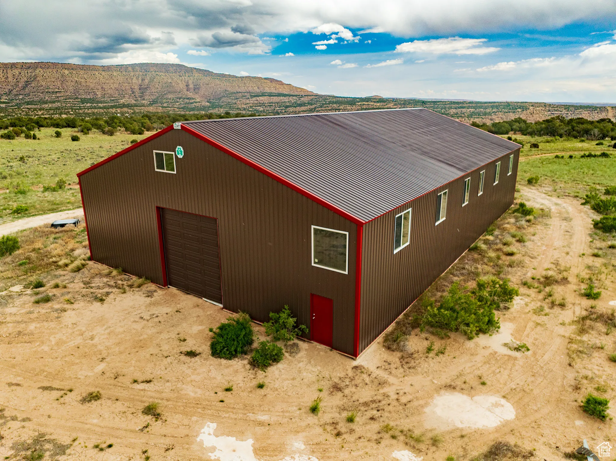 View of outdoor 60 x 90 Cleary Pole Barn Building featuring driveway and a mountain view