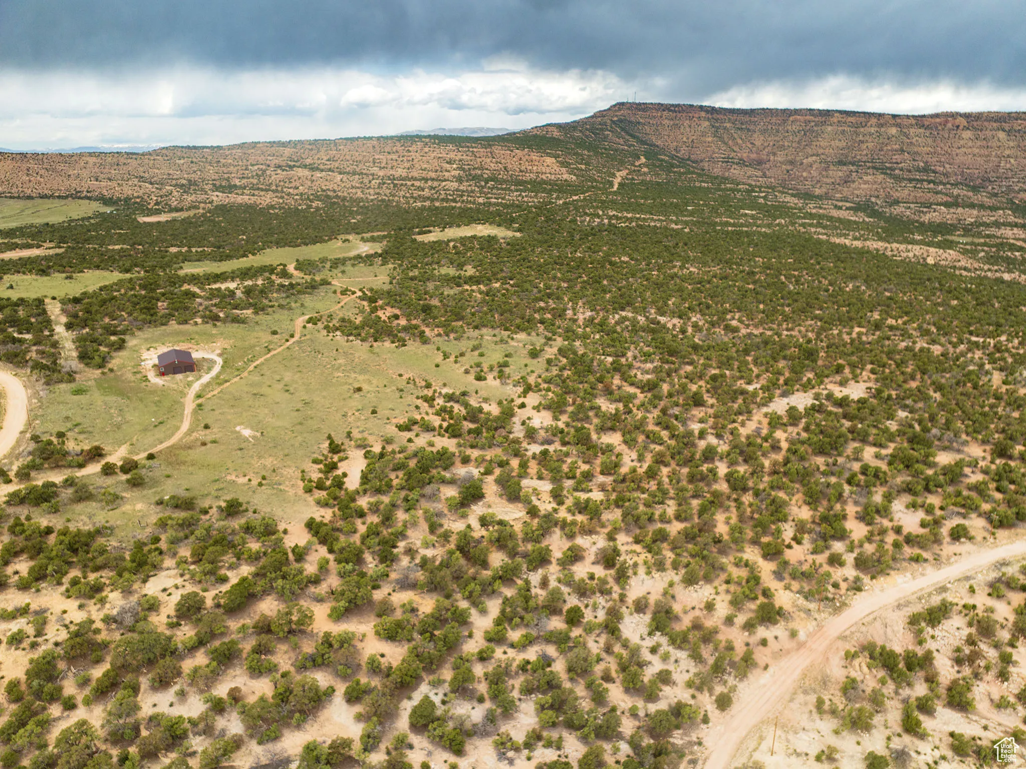 Aerial view of property's location featuring rural landscape and mountains