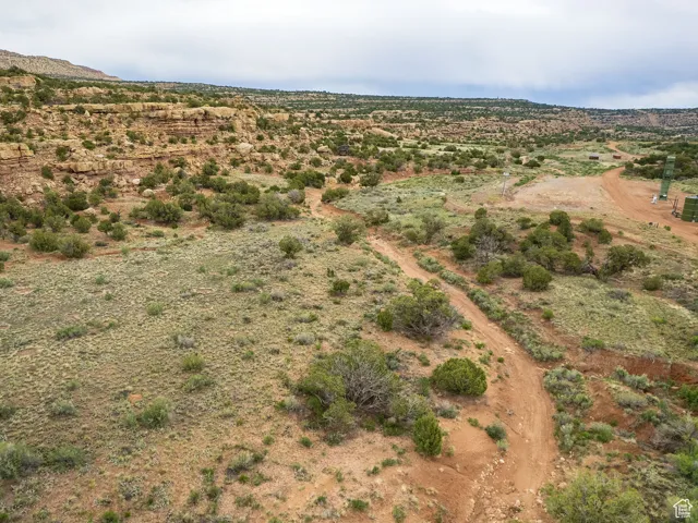 Aerial view of property and surrounding area featuring rural landscape