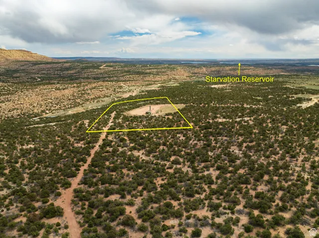 Aerial view of property and surrounding area with property boundaries highlighted